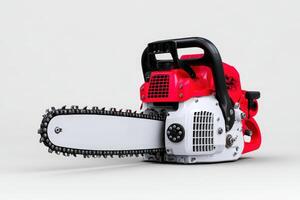 Chainsaw placed on the ground ready for outdoor cutting tasks photo