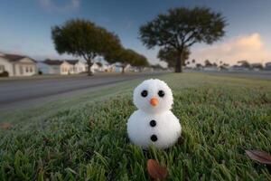 Snowman melting under the intense summer sun in a suburban neighborhood photo