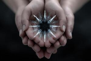 Holographic symbols float within a circle formed by two hands in a dark setting photo