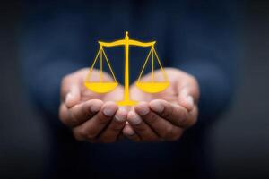 Holding a glowing scale of justice to symbolize fairness and equality in the legal system photo