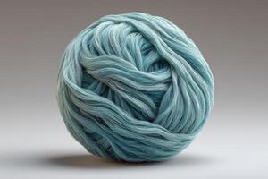 Fluffy ball of yarn displaying intricate fiber texture and soft color variations photo