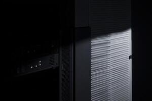 Unit features organized cable management with illuminated rear display at nighttime photo