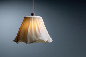 Broken umbrella creatively transformed into a unique hanging light fixture in a modern space photo