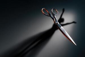 Scissors casting a shadow resembling a dancing figure on a dark background photo