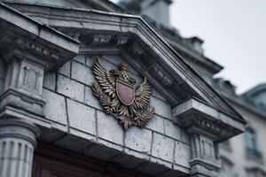 Majestic building facade featuring detailed architectural emblem from a faded yearbook cover photo
