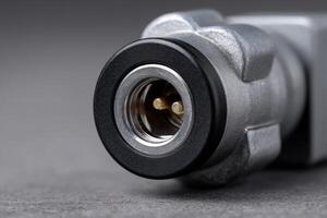 Power inlet on PDU featuring metallic screws and dual pin connection for electrical systems photo
