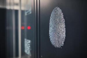 Fingerprint access panel displayed on a modern security system in a tech facility photo