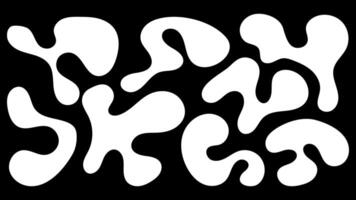 Organic blob shapes in irregular patterns on a black background showcasing unique forms vector