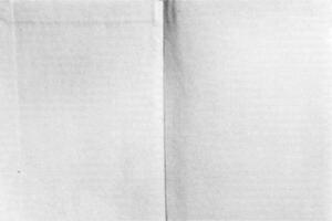 Realistic depiction of aged paper featuring a crumpled surface with a distinct grain and halftone pattern, revealing various creases and signs of wear over time. vector