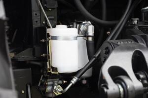 Close-up of a complex automotive engine system with white filters. photo