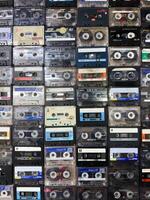 Moscow, Russia, April 27, 2025 Vertical retro background of vintage audio cassettes arranged in rows, ideal for nostalgic designs, music themed layouts or creative visual textures photo