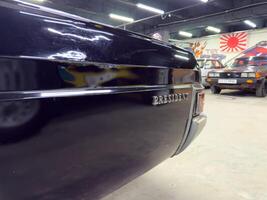 Moscow, Russia, April 27, 2025 Rear view of a vintage Toyota President showcasing the iconic chrome President badge on the trunk, reflecting the luxury status of this classic Japanese limousine photo