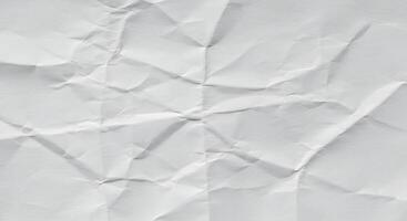 Crumpled white paper texture as a background image, ideal for presentation backgrounds, website banners, or creative typography posters with copy space. photo