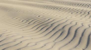 Natural wavy sand background, ideal for meditation apps, organic packaging design, or wellness-themed social media posts. photo