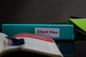 folders with the label Client files, Business management concept photo