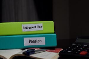 folders with the label Retirement plan and pension. Business management concept photo