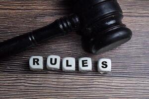 Concept of Rules Symbol wooden block and gavel, legal authority photo