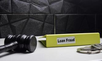 folders with labels loan fraud, financial and crime concept photo