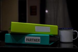 folders with the label partner, Business management concept photo