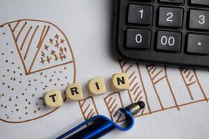 Concept of TRIN Symbol wooden block and chart photo