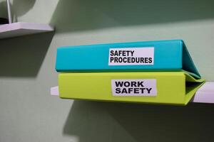 folders with the label safety procedures and work safety, Business management concept photo