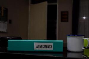 folders with the label Amendments, Business management concept photo