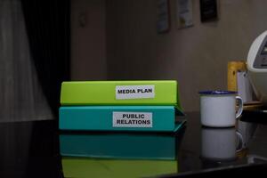 folders with the label Media plan and public relations, Business management concept photo