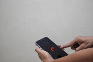 man hand using smartphone to switch off or shut down online and social connection, business, trade stock market and financial photo