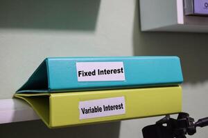 folders labeled fixed and variable interest, loan management concept photo