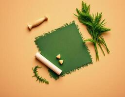 Green cloth with natural leaves and wooden tools on beige background, calm and natural setting photo