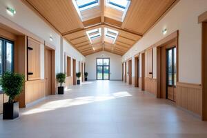 Light filled corridor with wooden paneling and skylights illuminating modern interior photo