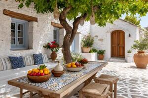 Cozy mediterranean patio with fresh fruit displayed on a rustic table photo