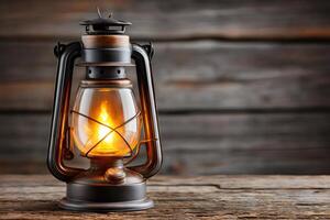Burning kerosene lamp illuminating rustic wooden table photo