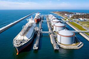 Lng terminal importing liquefied natural gas with tankers docked at port photo