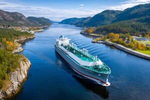 Large gas carrier navigating a fjord in norway on a clear autumn day photo