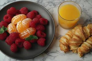 Fresh Breakfast Delight with Raspberries, Tangerines, and Croissants on Marble Background photo