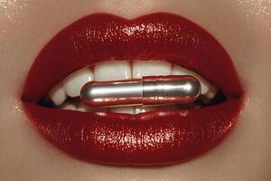 Elegant Fashion Concept with Red Glossy Lips and Metallic Capsule photo