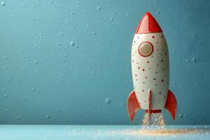 Retro Space Exploration Concept with Red and White Toy Rocket for Creative Design photo