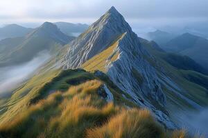 Majestic Mountain Peak at Sunrise with Misty Valleys for Nature and Travel Photography photo