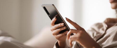 The smartphone in elegant hands for modern communication and relaxation. photo