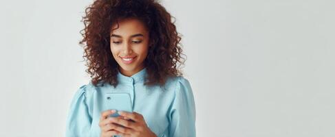 The young woman enjoying her smartphone in a casual, modern setting. photo