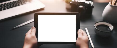The modern tablet in hands ready for creative applications and digital projects. photo