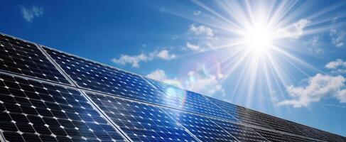 The solar panels absorbing sunlight in a bright blue sky with clouds photo