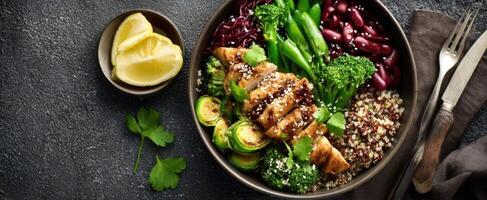 The beautiful arrangement of a healthy chicken and vegetable bowl. photo