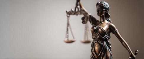 The iconic representation of justice through a bronze Lady Justice statue. photo