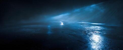 The mysterious blue landscape shrouded in fog and illuminated reflections. photo