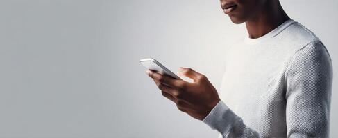 The person using a smartphone in a modern and casual setting. photo