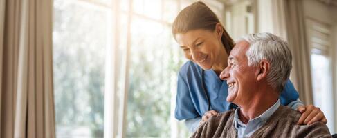 The caregiver providing emotional support and joy to an elderly client. photo