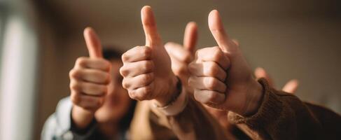 The group of hands giving thumbs up in celebration of success. photo