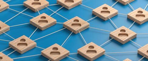 The interconnected network of wooden user icons on a blue background. photo